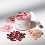 Load image into Gallery viewer, Open jar of Amaraa Relax + Unwind rose bath salt with pink crystals and dried rose petals