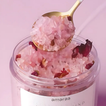 Load image into Gallery viewer, Pink bath salts with rose petals in clear jar and gold spoon, spa self-care product