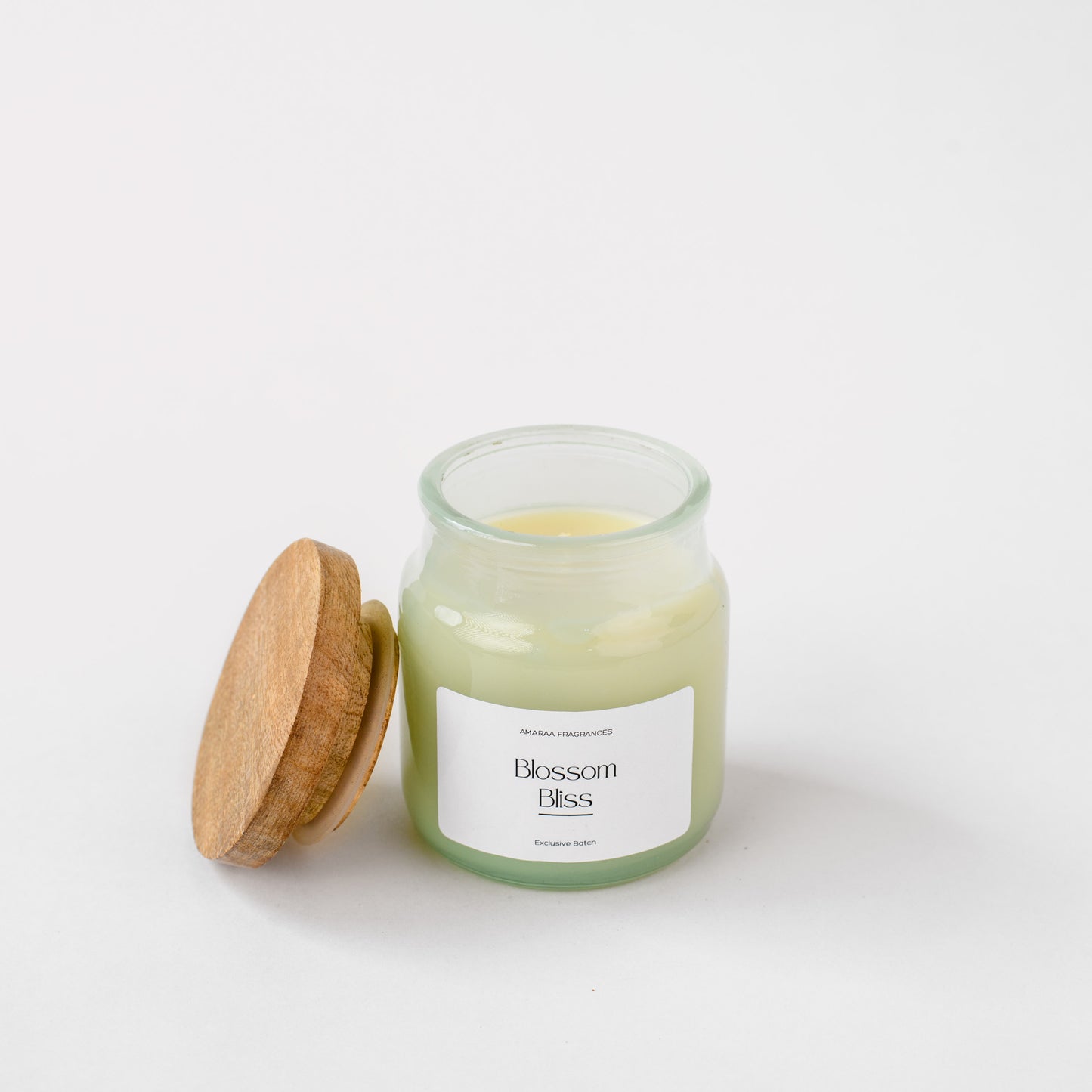 Blossom Bliss scented candle in glass jar with wooden lid on white background