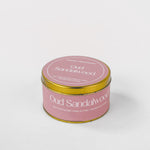 Load image into Gallery viewer, Oud Sandalwood soy wax candle in round pink and gold tin on white background
