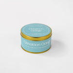 Load image into Gallery viewer, Cinnamon Orange soy wax candle in a gold tin with blue label on white background