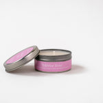 Load image into Gallery viewer, Bakhoor Rose soy wax candle in a metal tin with open lid on white background