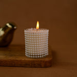 Load image into Gallery viewer, Decorative beaded glass candle burning on wooden tray with brown background