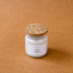 Load image into Gallery viewer, Musk Melody scented candle with wooden lid on brown background