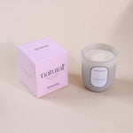Load image into Gallery viewer, Amaraa natural soy wax candle in frosted glass with pink box on beige background
