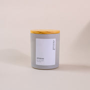 Gray glass soy wax candle with wooden lid on neutral background, labeled 'eternal amaraa'.