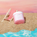 Load image into Gallery viewer, Velvet Rose whipped soap by amaraa on sandy beach with striped chair and blue water