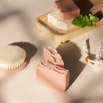 Load image into Gallery viewer, Handmade pink and white soap bars on bamboo tray with body brush, mint leaf, and rope scrubber