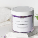 Load image into Gallery viewer, Amaraa lavender bath salt jar on white stone with towels and plant, relaxing spa product