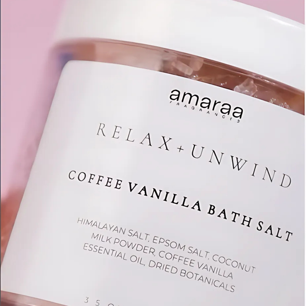 Amaraa Coffee Vanilla Bath Salt jar with Himalayan salt on a pink background