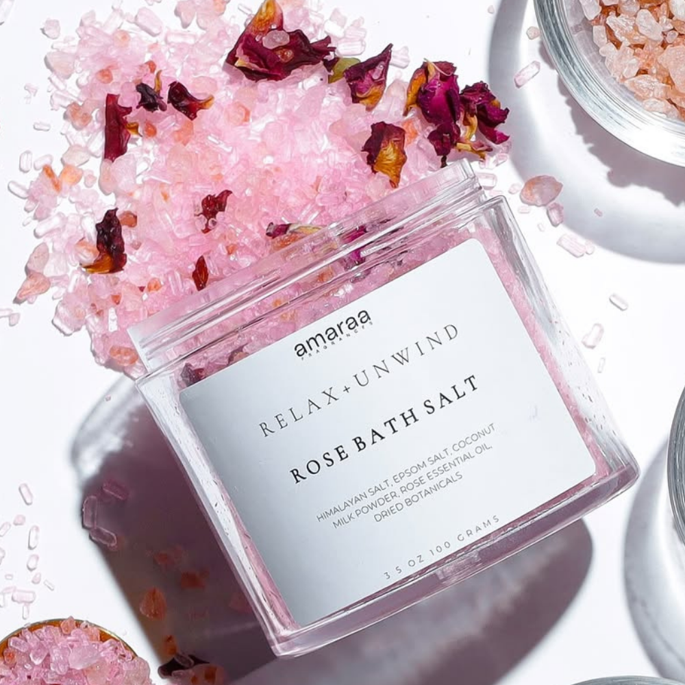 Amaraa rose bath salt jar with pink Himalayan salt and dried rose petals on white background