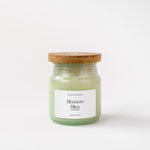Load image into Gallery viewer, Blossom Bliss scented candle in glass jar with wooden lid on white background