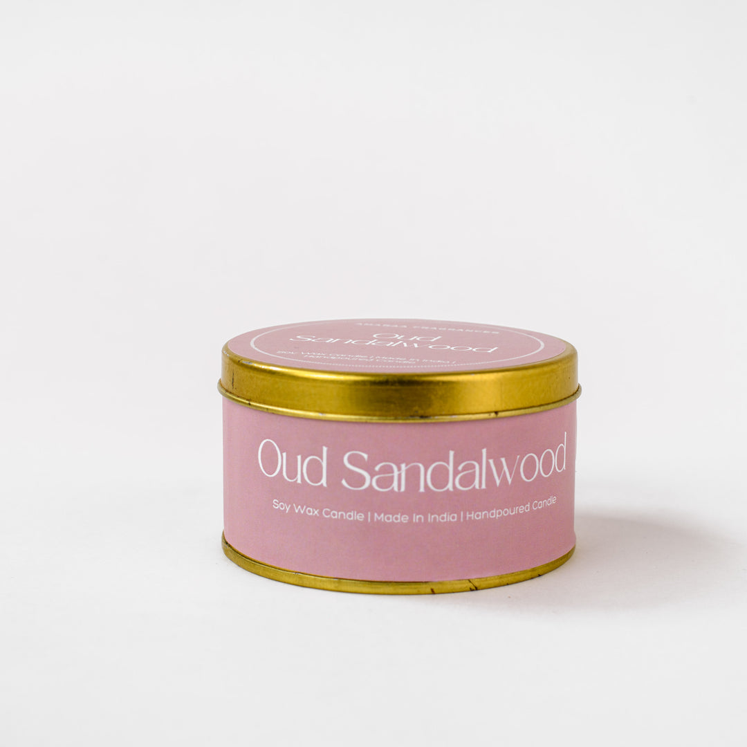 Oud Sandalwood soy wax candle with gold lid on white background