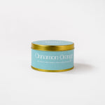 Load image into Gallery viewer, Cinnamon Orange soy wax candle in a blue tin with gold lid on white background
