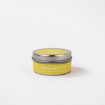 Load image into Gallery viewer, Champagne Toast soy wax candle in a small metal tin with yellow label on white background