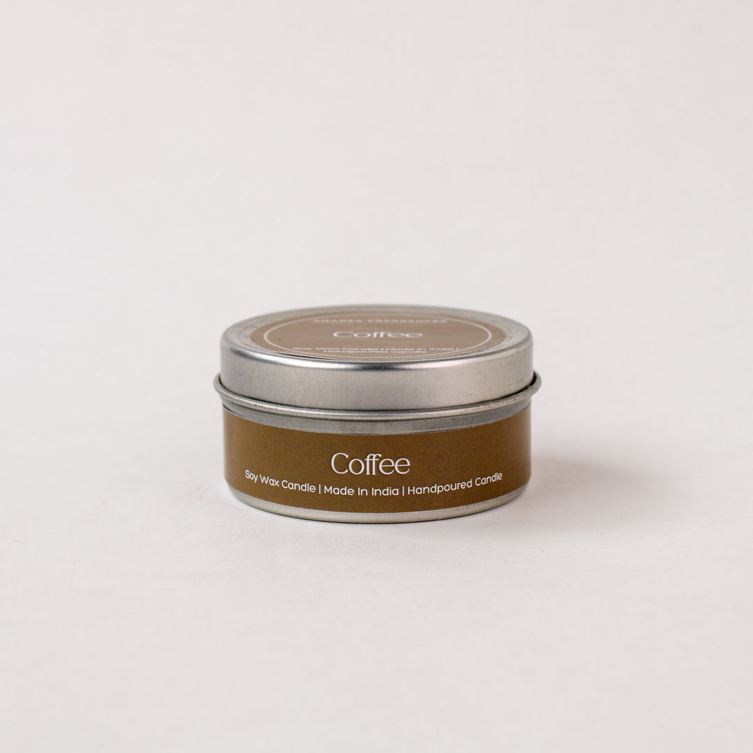 Coffee soy wax candle in a brown metal tin, handpoured, on a white background