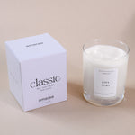 Load image into Gallery viewer, Amaraa classic soy wax candle in glass with white box, labeled Love Story, on beige surface