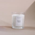 Load image into Gallery viewer, Morning Blush soy wax candle in clear glass jar on beige background, Amaraa Fragrances branding
