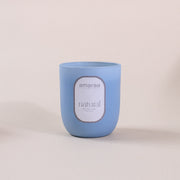 Blue Amaraa Fragrances natural soy wax candle on light background