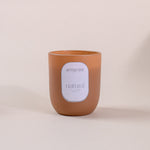 Load image into Gallery viewer, Brown amaraa natural soy wax candle with label on neutral background
