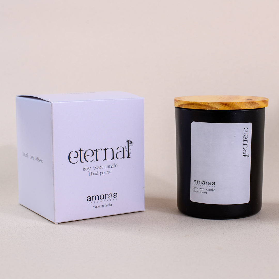 Eternal soy wax candle in black jar with wood lid and branded box by Amaraa Fragrances