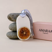 AMARAA fragrance scented sachet with dried orange slice, ribbon, stones, and pink box