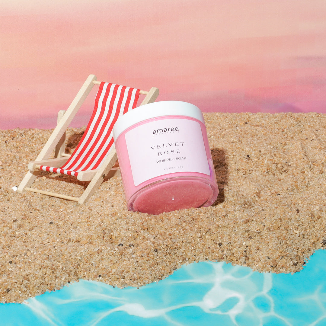 Velvet Rose whipped soap by amaraa on sandy beach with striped chair and blue water